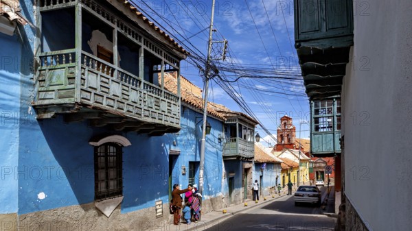 Street with traditional houses and a lively urban atmosphere, The streets of the historic centre of Potosi in Bolivia