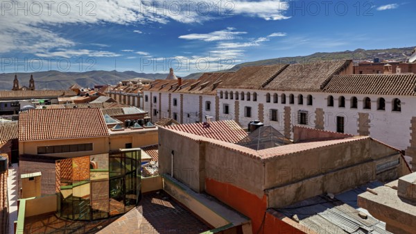 Urban view with tiled roofs under a clear blue sky, The streets of the historic centre of Potosi in Bolivia