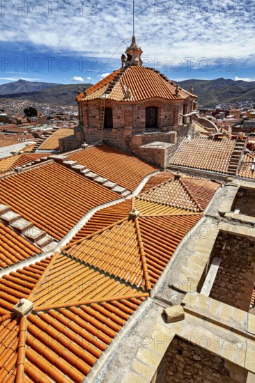 Detailed architecture with striking roof tiles, embedded in a mountain landscape, The roof of Potosi Cathedral in Bolivia