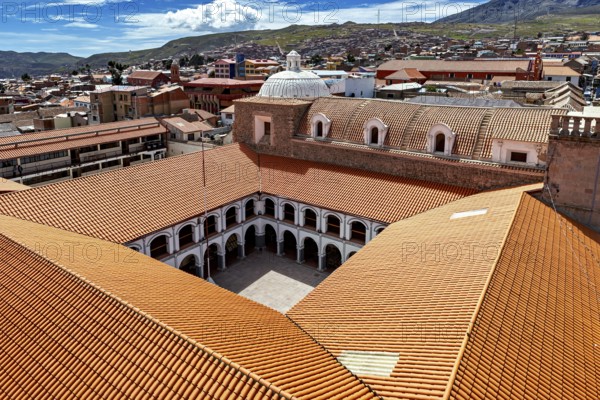 Architectural courtyard of a monastery with tiled roofs in a city, view over the city of Potosi in Bolivia