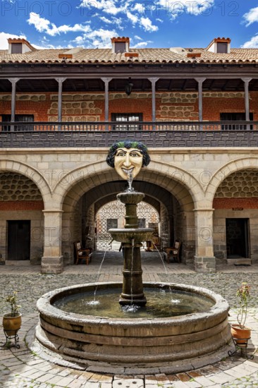 Historic courtyard with decorative fountain and arcades, The courtyard with fountain in the museum of Potosi in Bolivia