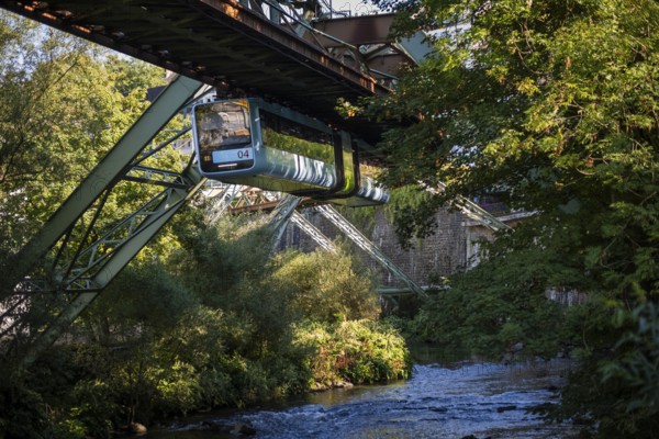 The Wuppertal suspension railway over the riverbed of the Wupper near the Kluse stop, Wuppertal, Germany, digitally reworked