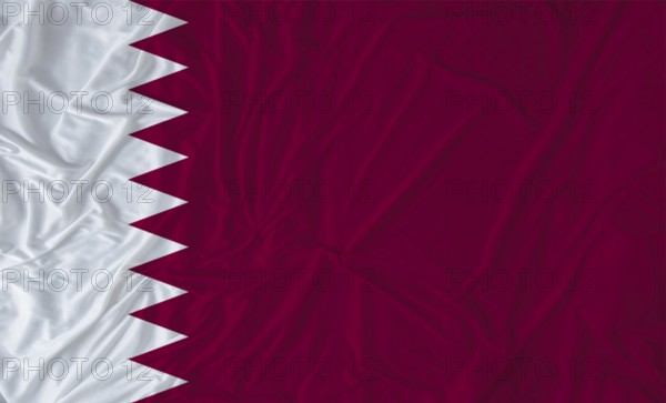 Qatar flag with fabric texture waving. Close up of flag of Qatar with cloth texture