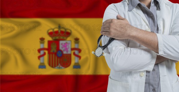 Doctor with stethoscope on arm with Spain flag behind. National health system of Spain, concept