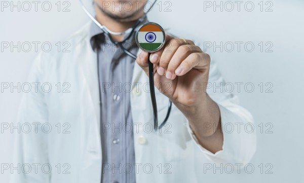 India national healthcare. Doctor showing stethoscope with India flag