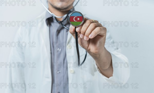Azerbaijan national healthcare. Doctor showing stethoscope with Azerbaijan flag