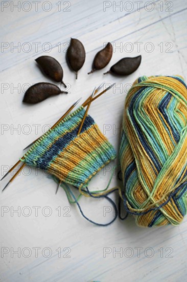 Coloured wool with started knitted sock