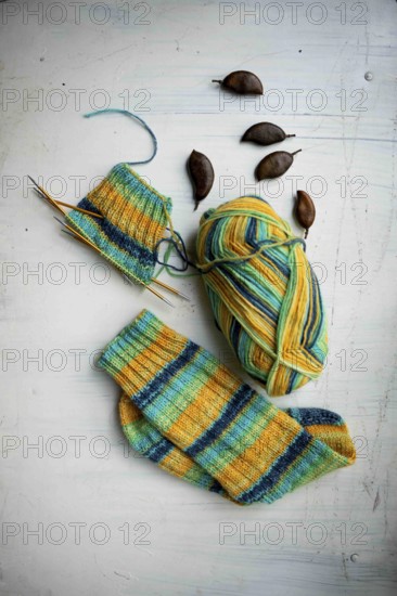 Coloured wool with started knitted sock