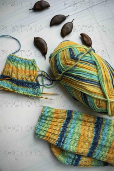 Coloured wool with started knitted sock