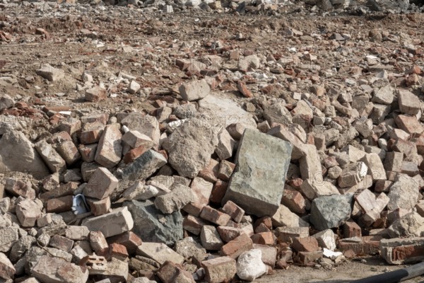 Accumulation of broken bricks and concrete from construction demolition site
