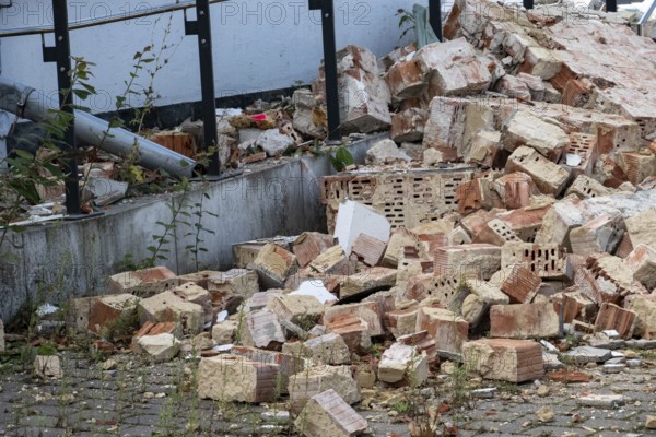 Pile of broken bricks and concrete rubble from a demolished building