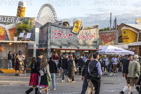 Folk festival time in Stuttgart. The 178th Cannstatter Volksfest on the Wasen is one of the most important traditional festivals in Germany. In addition to the large festival tents, the Wasen is characterised by fairground attractions. Around 320 showmen, festival hosts and market traders expect around four million visitors. Bad Cannstatt, Stuttgart, Baden-Württemberg, Germany