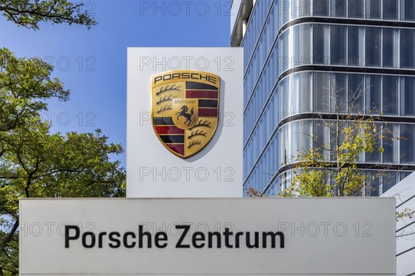 Porsche Centre Autohaus am Pragsattel. Porsche Design Tower skyscraper. Logo on a stele. Stuttgart, Baden-Württemberg, Germany