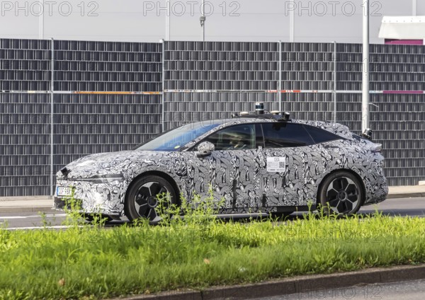 Prototype with camouflage livery on the road in Stuttgart. Zeekr Model 007 electric vehicle from Chinese car manufacturer Geely. Autonomous driving, test drive by Bosch Automotive. Stuttgart, Baden-Württemberg, Germany