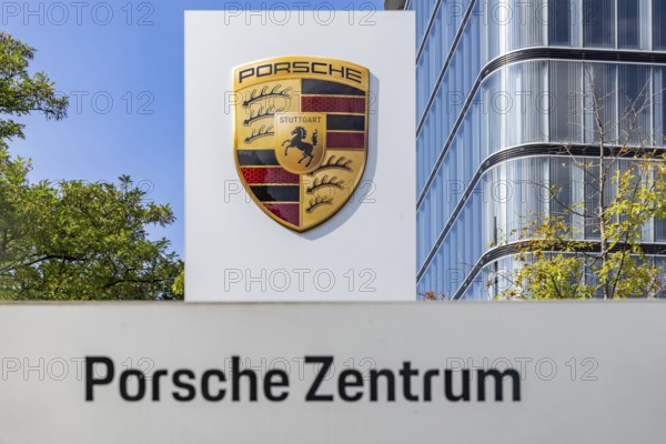 Porsche Centre Autohaus am Pragsattel. Porsche Design Tower skyscraper. Logo on a stele. Stuttgart, Baden-Württemberg, Germany