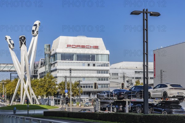 Porscheplatz with Porsche headquarters. Inspiration 911 artwork by Gerry Judah: three steles, each presenting a Porsche 911 at a height of up to 24 metres. Zuffenhausen, Stuttgart, Baden-Württemberg, Germany