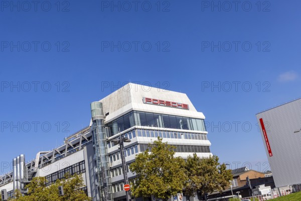 Porscheplatz in Stuttgart Zuffenhausen. Porsche headquarters with company logo. Stuttgart, Baden-Württemberg, Germany