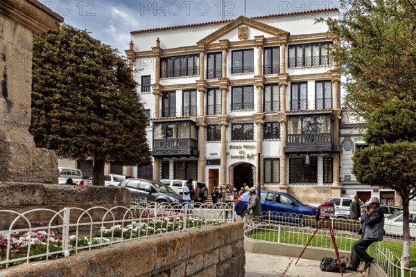 Urban scene with art museum and people in a lively outdoor area, house facade in the city of Potosi Bolivia