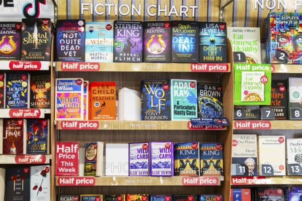 Fiction chart of bestselling books inside WH Smith, TG Jones, bookshop, England, UK