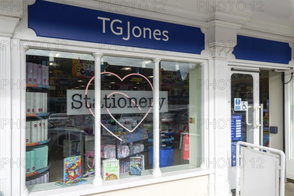 TG Jones shop signage rebranded WH Smith store, High Street, Marlborough, Wiltshire, England, UK