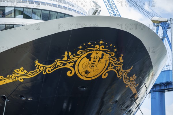Detailed view of the decorated bow of a cruise ship with a crane in the background, cruise ship in the Meyer shipyard in Papenburg