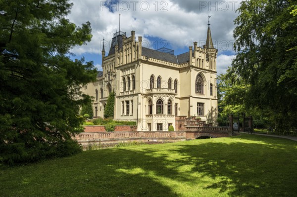 A Gothic castle with towers and lawns in summery surroundings, Schloss Evenburg, Leer, East Frisia
