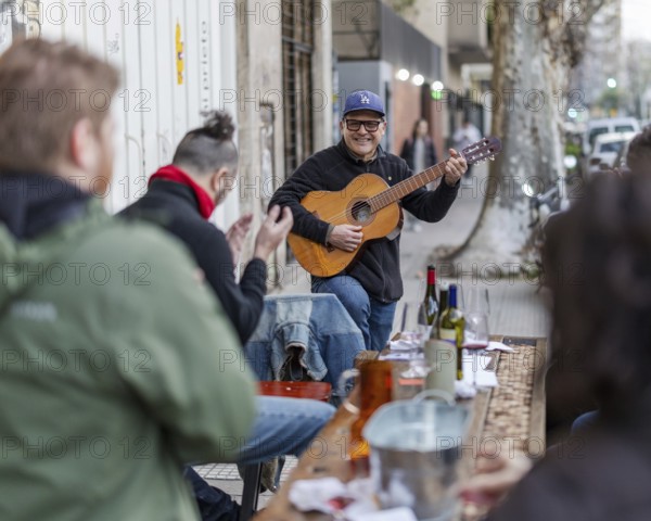 Street scene with musician, Palermo neighbourhood, Buenos Aires, capital of Argentina