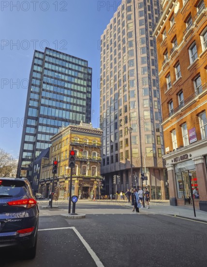 LONDON, UNITED KINGDOM - APRIL 15, 2023 Street view of The Albert pub in London, a striking vintage Victorian style building contrasting with the modern high-rise constructions