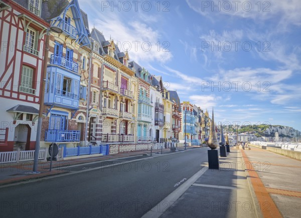 Charming Belle Epoque villas of Mers-les-Bains coastline town, arranged along the seaside promenade. Distinctive half-timbered architecture of different bright colors in Picardy, France