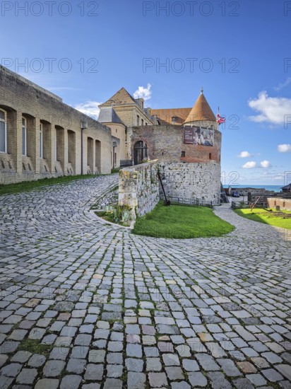 DIEPPE, FRANCE - AUGUST 27, 2023 A cobbled path curves towards the entrance of Dieppe Castle, a historic french fortress in Normandy