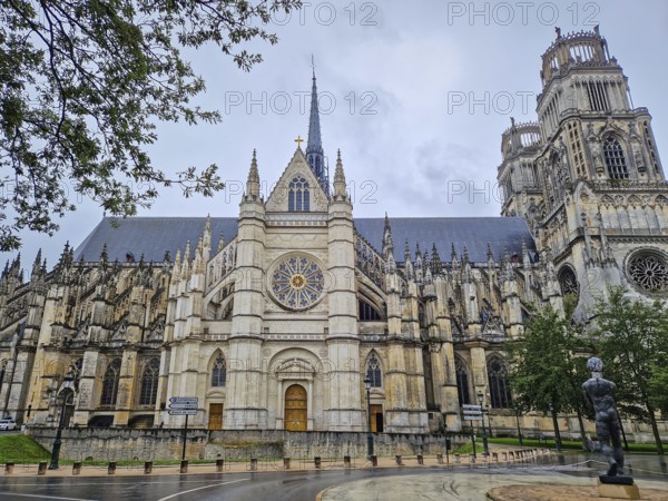 The magnificent Flamboyant Gothic Orleans Cathedral of the Holy Cross on a rainy day. French basilique Sainte-Croix ornate with twin towers and a large rose windows