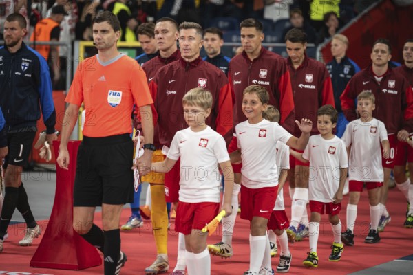 CHORZOW, POLAND - SEPTEMBER 7, 2025: Qualifications for FIFA 2026. Football match Poland vs Finland. referee capitan Robert Lewandowski and team of Poland
