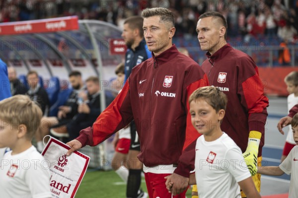 CHORZOW, POLAND - SEPTEMBER 7, 2025: Qualifications for FIFA 2026. Football match Poland vs Finland. referee capitan Robert Lewandowski (L) and tLukasz Skorupski (R)