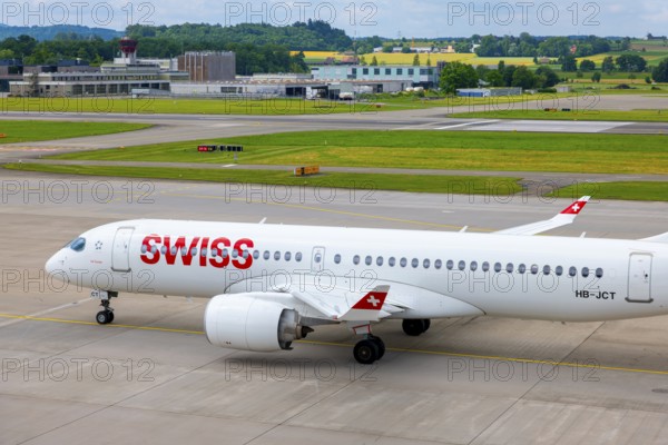 Swiss Airlines Passenger Airplane Taxiing on Runway in a Sunny Summer Day From the Airport in Kloten, Zurich, Zurich Canton, Switzerland