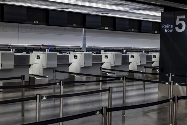 Illuminated and Empty Airport Check in Counter in Zurich Airport at Night in Kloten, Zurich, Zurich Canton, Switzerland
