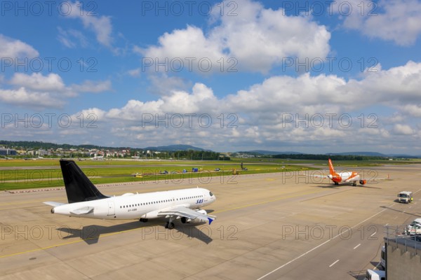 SAS and Easyjet Airlines Passenger Airplane Taxiing and Take Off on Runway in a Sunny Summer Day From the Airport in Kloten, Zurich, Zurich Canton, Switzerland