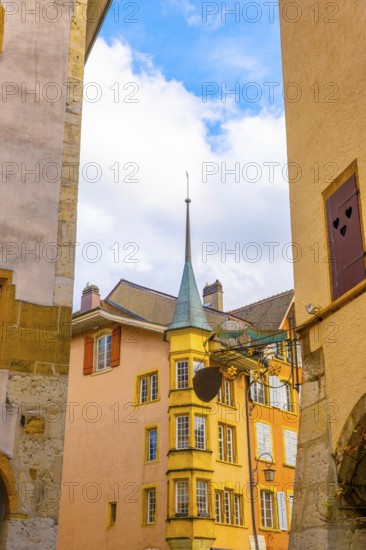 Old Town with Corner House with Tower and Sky and Clouds in a Sunny Autumn Day in City of Biel, Bienne, Bern Canton, Switzerland