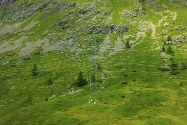 Electricity Pylon with Mountain View in the Swiss Alps in a Sunny Summer Day in Bernina, Valposchiavo, Pontresina, Grisons, Switzerland