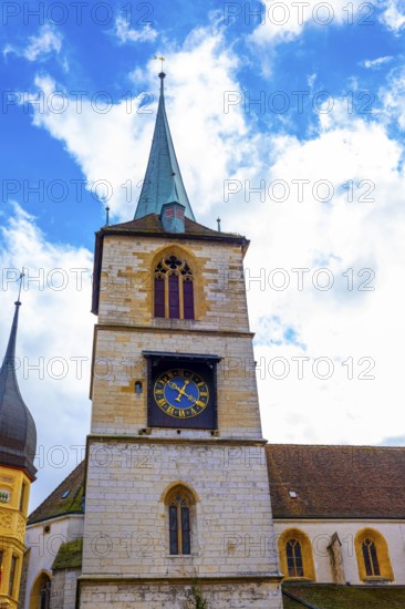 Old Town with House and Clock Tower with Sky and Clouds in a Sunny Autumn Day in City of Biel, Bienne, Bern Canton, Switzerland