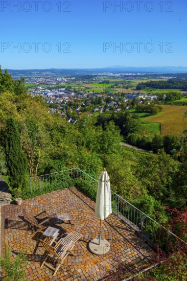 Panoramic View over City and Landscape with a Terrace with Chair and Parasol From Medieval Old Town in a Sunny Summer Day with Blue Sky in Regensberg, Zurich Canton, Switzerland