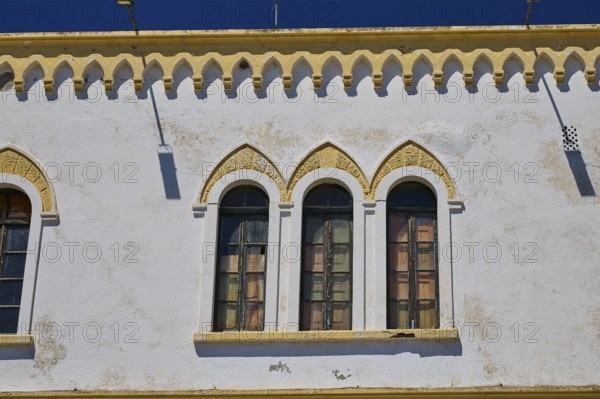 Marine Administration, Caserma Marina 1930, Today Municipal Administration, Close-up of arched windows on a historic white building, Historicism, Art Deco, Rationalism, Portolago, Lakki, Leros, Dodecanese, Greek Islands, Greece