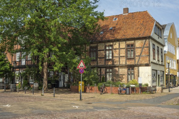 Half-timbered building with red bricks on a quiet street. Bicycles are also available, Verden an der Aller, Lower Saxony, Germany