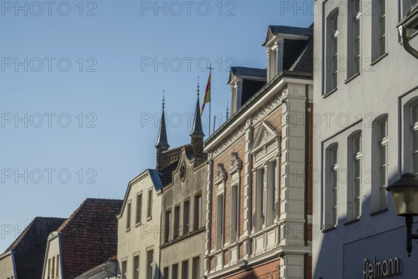 Row of historic buildings with ornate facades under a clear sky, Warendorf, Münsterland, North Rhine-Westphalia