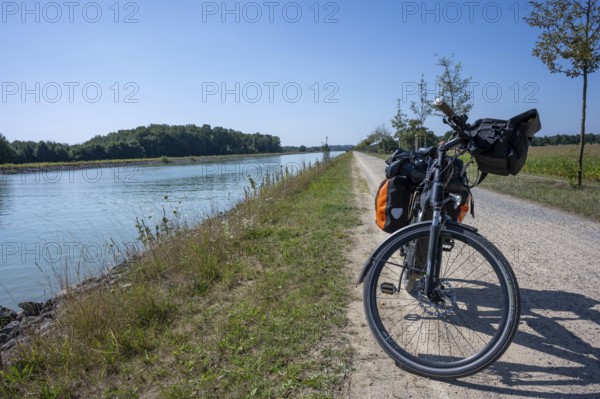 Bicycle on the riverside path under a clear sky. Sunny day with a view of the countryside, Dortmund-Ems Canal near Lüdinghausen, Münsterland, North Rhine-Westphalia