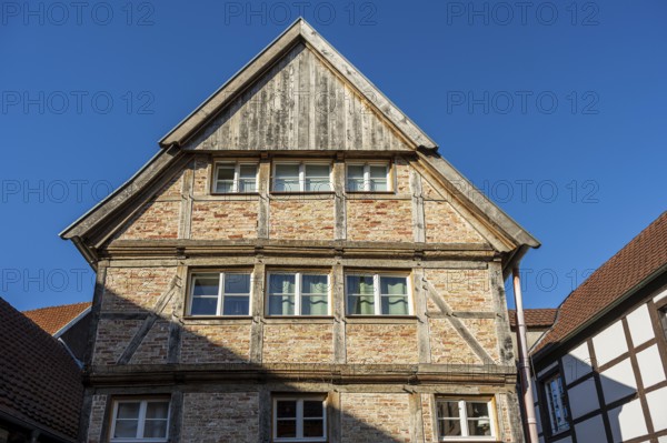 Large half-timbered house under a blue sky, representing traditional architecture, Warendorf, Münsterland, North Rhine-Westphalia