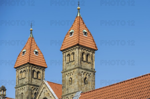 Two Gothic church towers with red tiled roofs under a clear blue sky, St Mary's Church in Warendorf, Münsterland, North Rhine-Westphalia