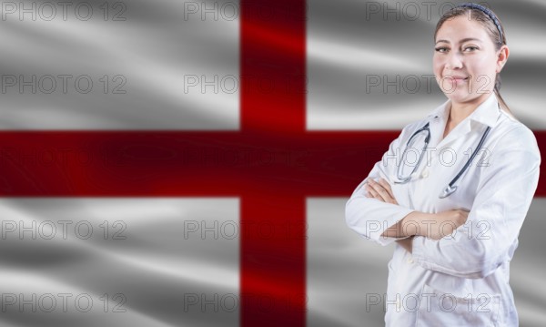 Female doctor on England flag. Doctor with crossed arms on England flag. England health and care concept