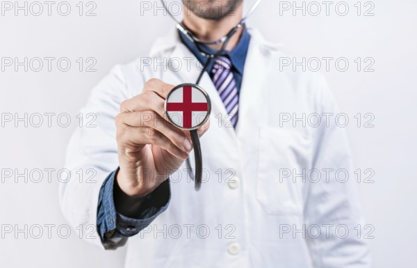 England healthcare system, doctor holding stethoscope. England health and medical insurance concept