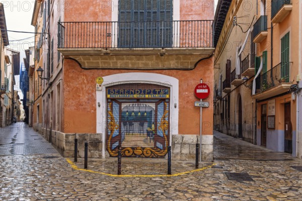 Mural painting on a jalousie to a street corner restaurant in the old town of Palma, Palma de Mallorca, Mallorca, Spain