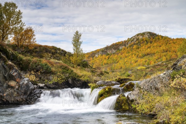 Waterfall and autumn landscape, River Grimse, Grimsdalen, Rondane, Dovre, Norway